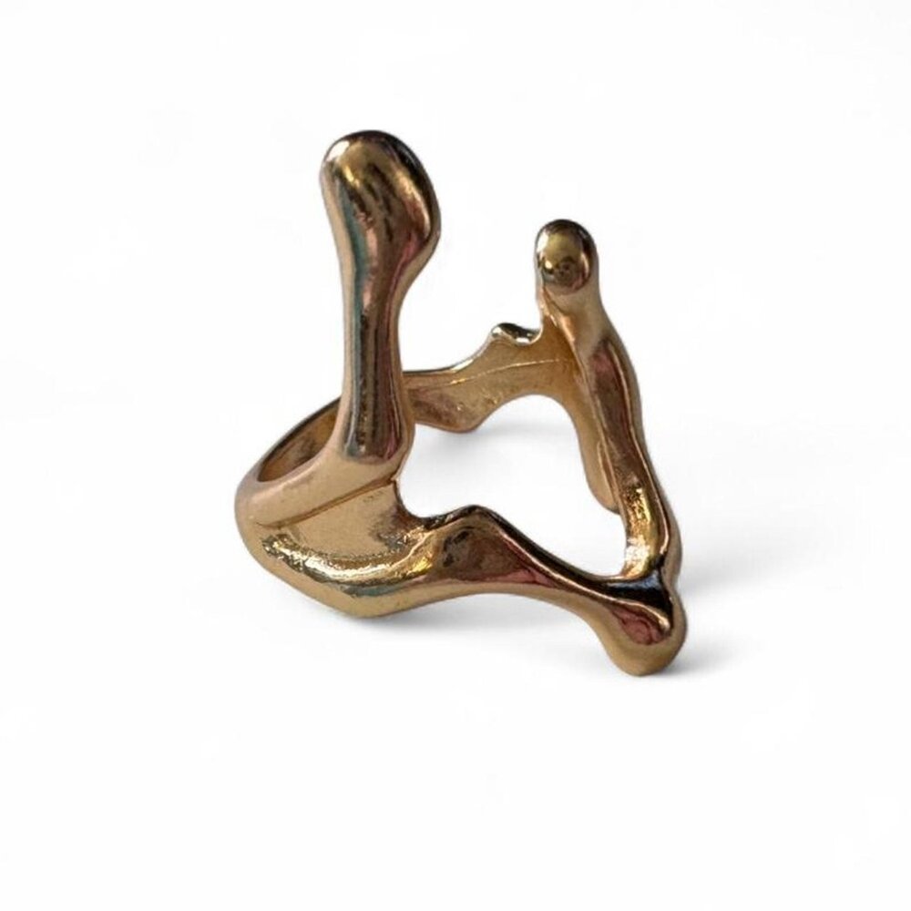 Size 7 Gold abstract ring with a unique design...
